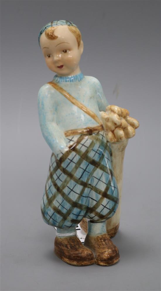 A Goldscheider porcelain figure of a boy golfer H.21cm